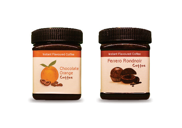 A product image of a Hetal's Homemade coffee combo. The image shows two coffees, chocolate orange flavoured instant coffee and Ferrero Rocher flavoured instant coffee. All our products are 100% homemade and contains no added preservatives.