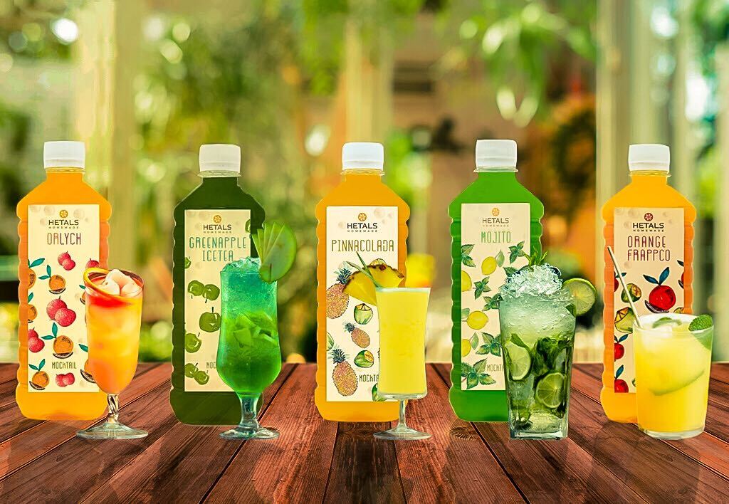 The image shows Hetal's Homemade mocktail range. The image shows 5 flavours from left to right , orlych, Green Apple iced tea, pina colada , mojito and orange frappco.