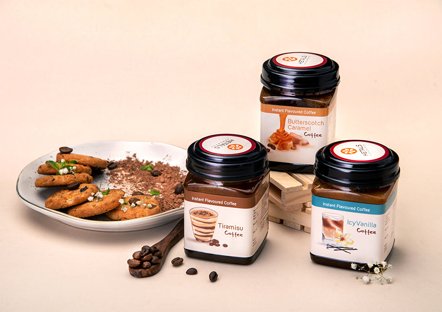 An image of three flavoured instant coffees. The photo shows Icy Vanilla, Tiramisu and Butterscotch Caramel flavoured instant coffee.