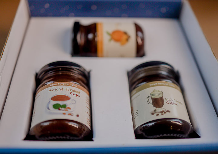 A close up image of Hetal's Homemade coffee hamper. The coffee hamper includes irish cream coffee , orange coffee and almond hazelnut flavoured coffee. All our coffees are 100% homemade and contains no preservatives.